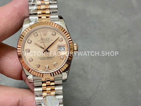 Stylish Rolex Datejust replica featuring MOP pink dial, two tone rose gold finish and classic Jubilee bracelet.