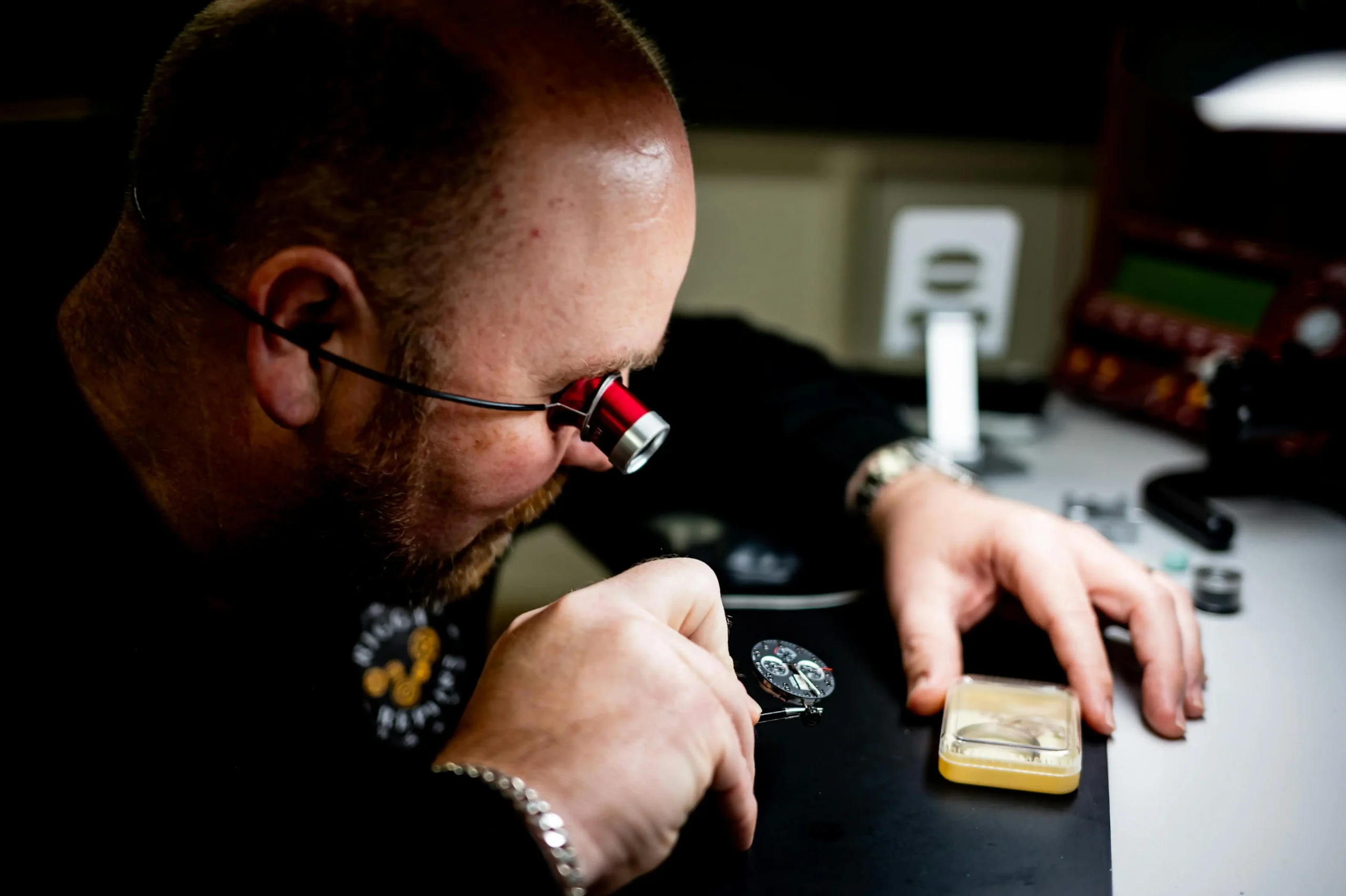Replica watch quality control process with technician inspecting a super clone watch, highlighting VS factory standards and precision
