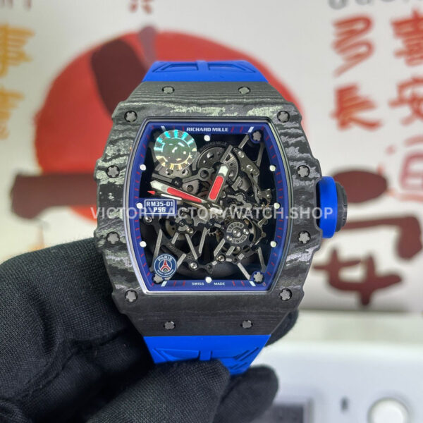ZF Factory Richard Mille RM 35-01 PSG 42mm Black Carbon Fiber Blue Rubber Strap Black Skeletonized Dial (8) ZF RM 35-01 PSG uses black carbon fiber with blue rubber strap and black skeletonized dial, creating a sportier football-inspired luxury watch style.