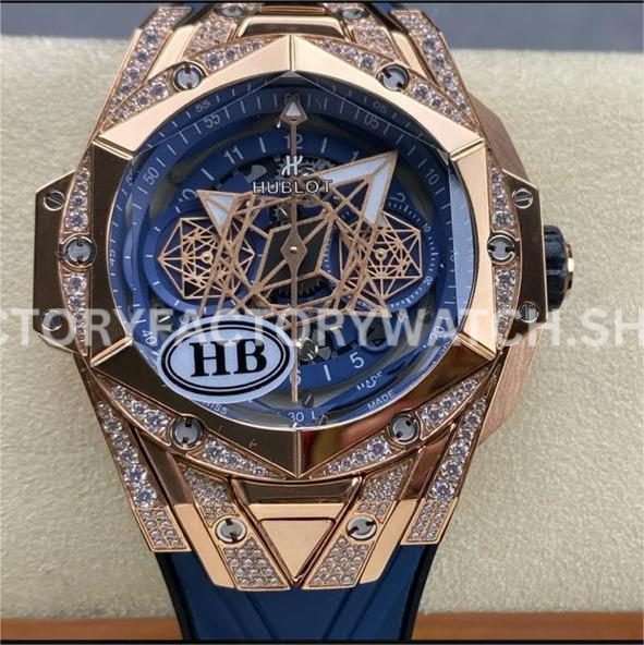 HB Factory Hublot Big Bang Sang Bleu 45mm with diamond rose gold styling, skeletonized blue dial, and blue rubber strap.