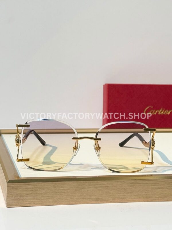 Cartier CT02283O Rimless Sunglasses Gold-Tone Panther Temples & Purple–Yellow Gradient Lenses (3) Cartier CT02283O Rimless Sunglasses | Gold-Tone Panther Temples & Purple–Yellow Gradient Lenses