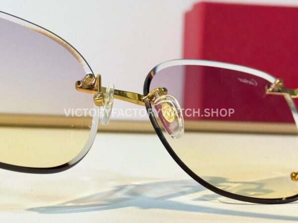 Cartier CT02283O Rimless Sunglasses Gold-Tone Panther Temples & Purple–Yellow Gradient Lenses (6) Cartier CT02283O Rimless Sunglasses | Gold-Tone Panther Temples & Purple–Yellow Gradient Lenses