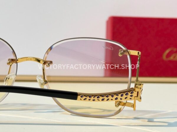 Cartier CT02283O Rimless Sunglasses Gold-Tone Panther Temples & Purple–Yellow Gradient Lenses (9) Cartier CT02283O Rimless Sunglasses | Gold-Tone Panther Temples & Purple–Yellow Gradient Lenses